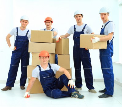 Professional removal van and movers in a St Johns Wood residential street