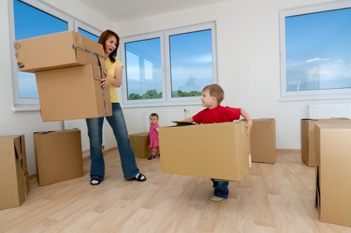 Removal team loading boxes and household items for a flat move in St Johns Wood