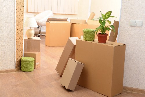 Packed office equipment and labelled boxes ready for relocation