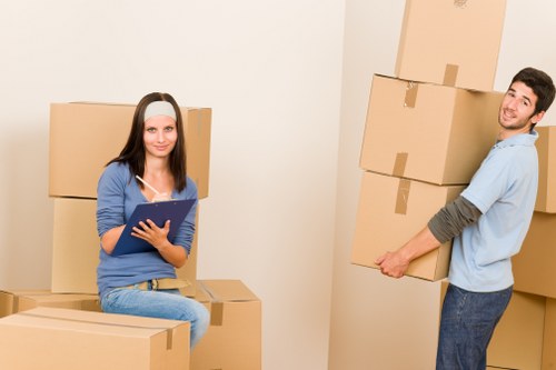 Removal van and packed boxes near St Johns Wood apartment buildings